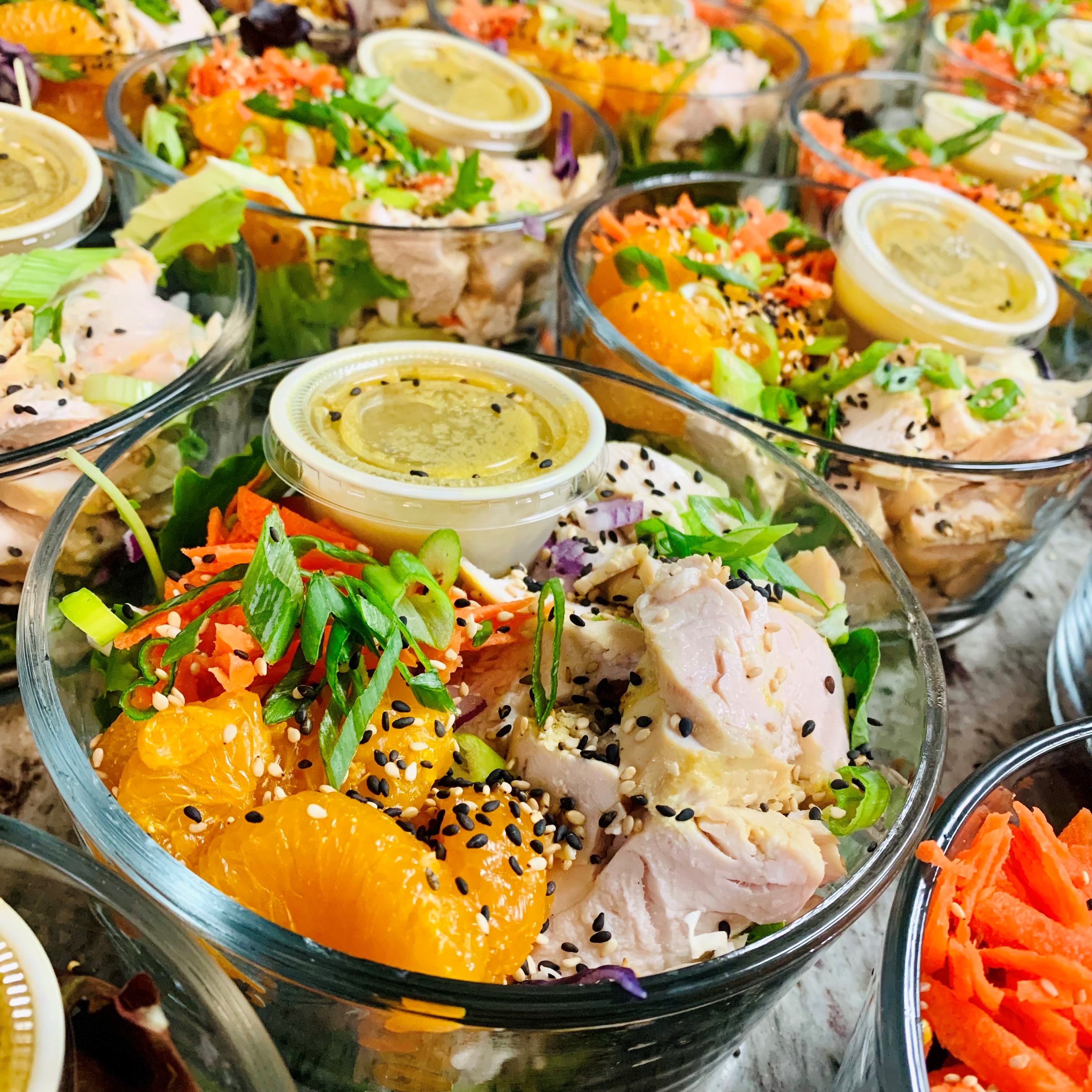 Weekly meal prep business Living Simply Kitchen's chicken rice bowl with orange and fresh dressing