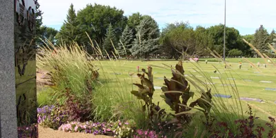 Flowers at the cemetery and headstones in the background